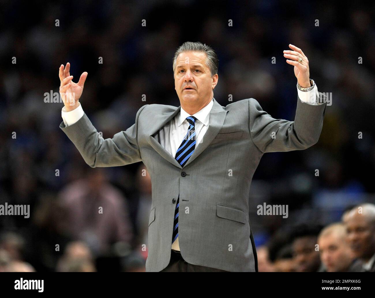 Kentucky coach John Calipari motions to his team during the first half ...