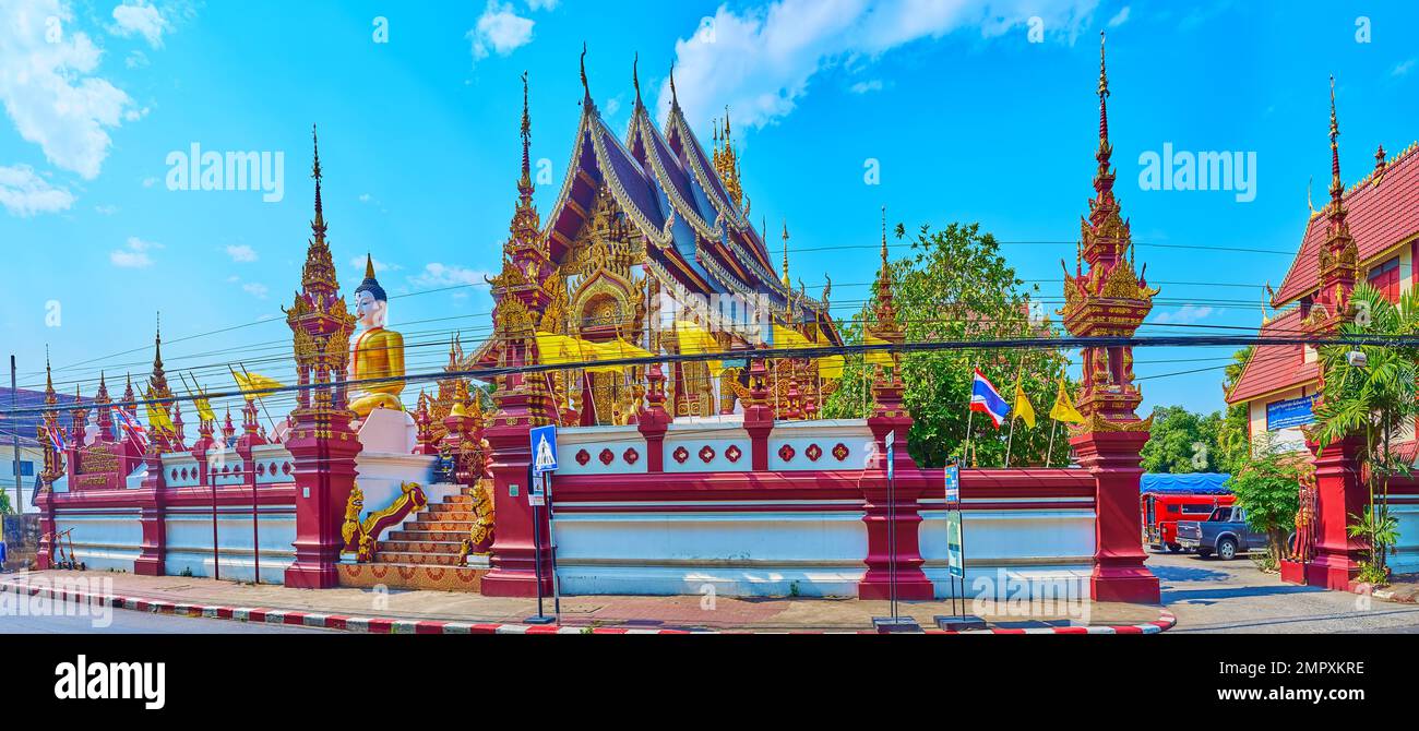 Panorama of splendid Wat Ratcha Monthian with Buddha Image, pyathat roof of upper viharn, Ku shrines and mythical creatures statues, Chiang Mai, Thail Stock Photo