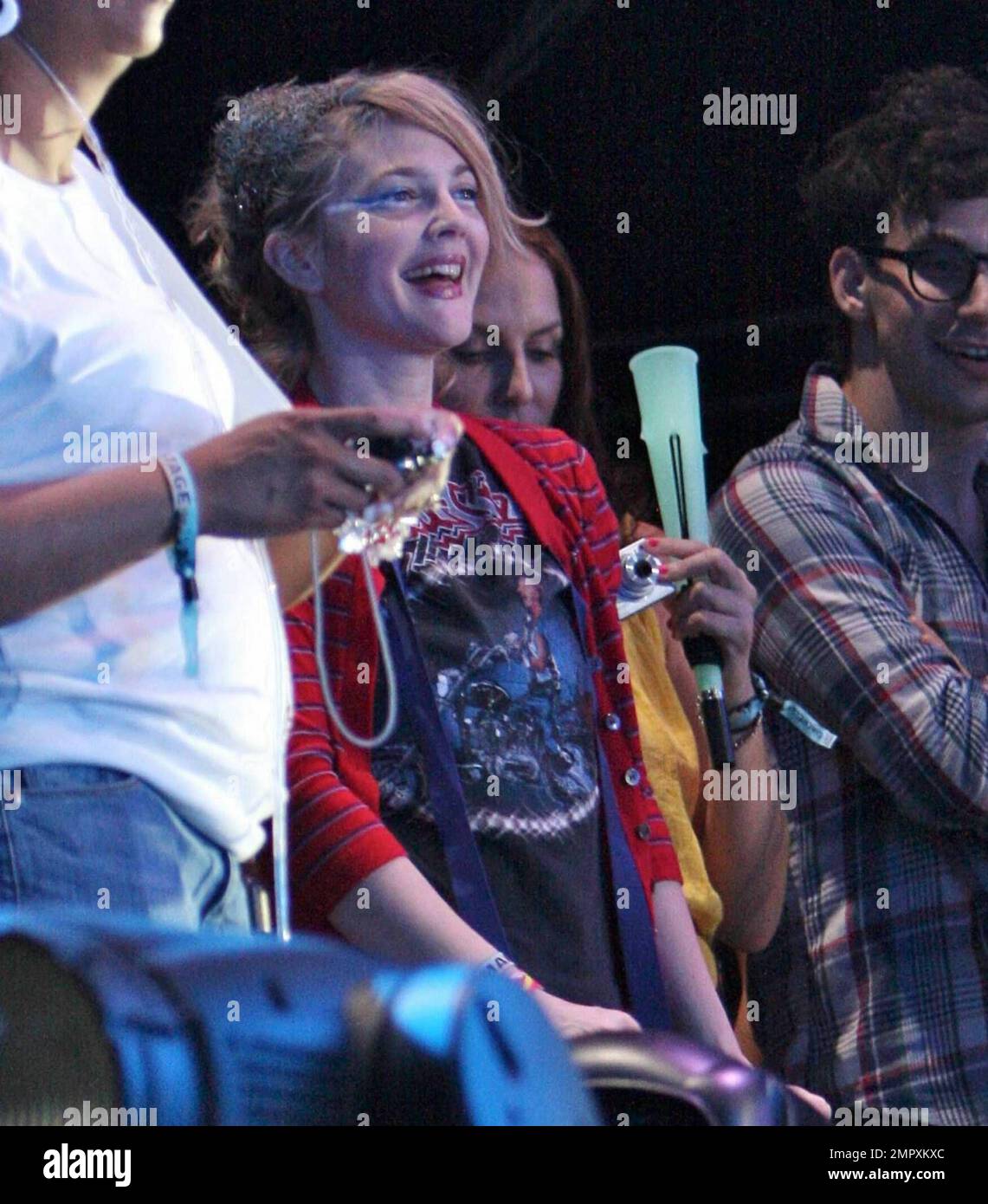 Drew Barrymore and recently reconciled boyfriend Justin Long watch the M.I.A concert.  Long took pictures of Barrymore on his iphone before she appeared up onstage during the concert throwing glow sticks into the audience at Coachella Music and Arts Festival 2009. Indio,CA. 04/18/2009.    . Stock Photo