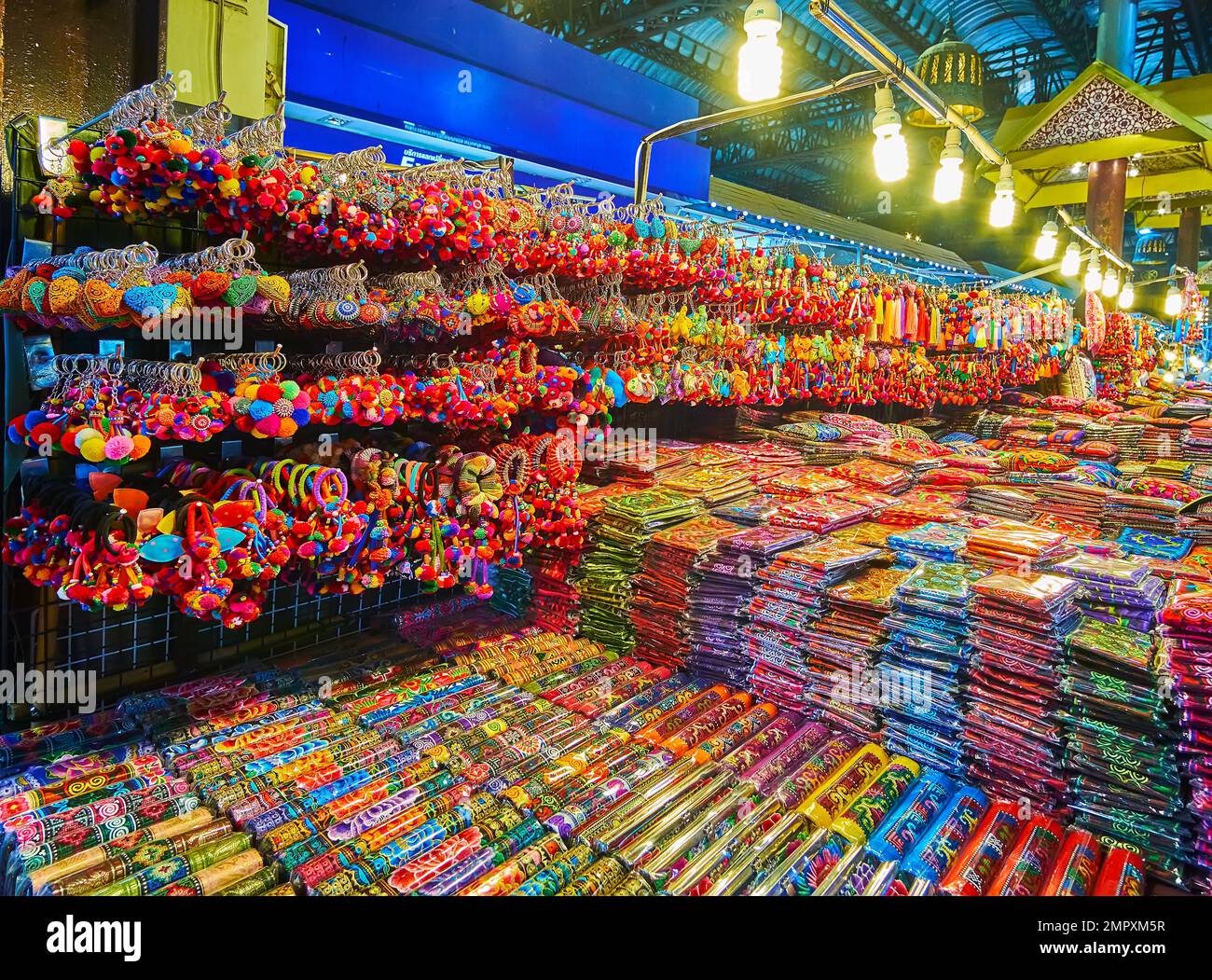 The stall of Night Market with hanging keychains and other souvenirs, Chiang Mai, Thailand Stock Photo