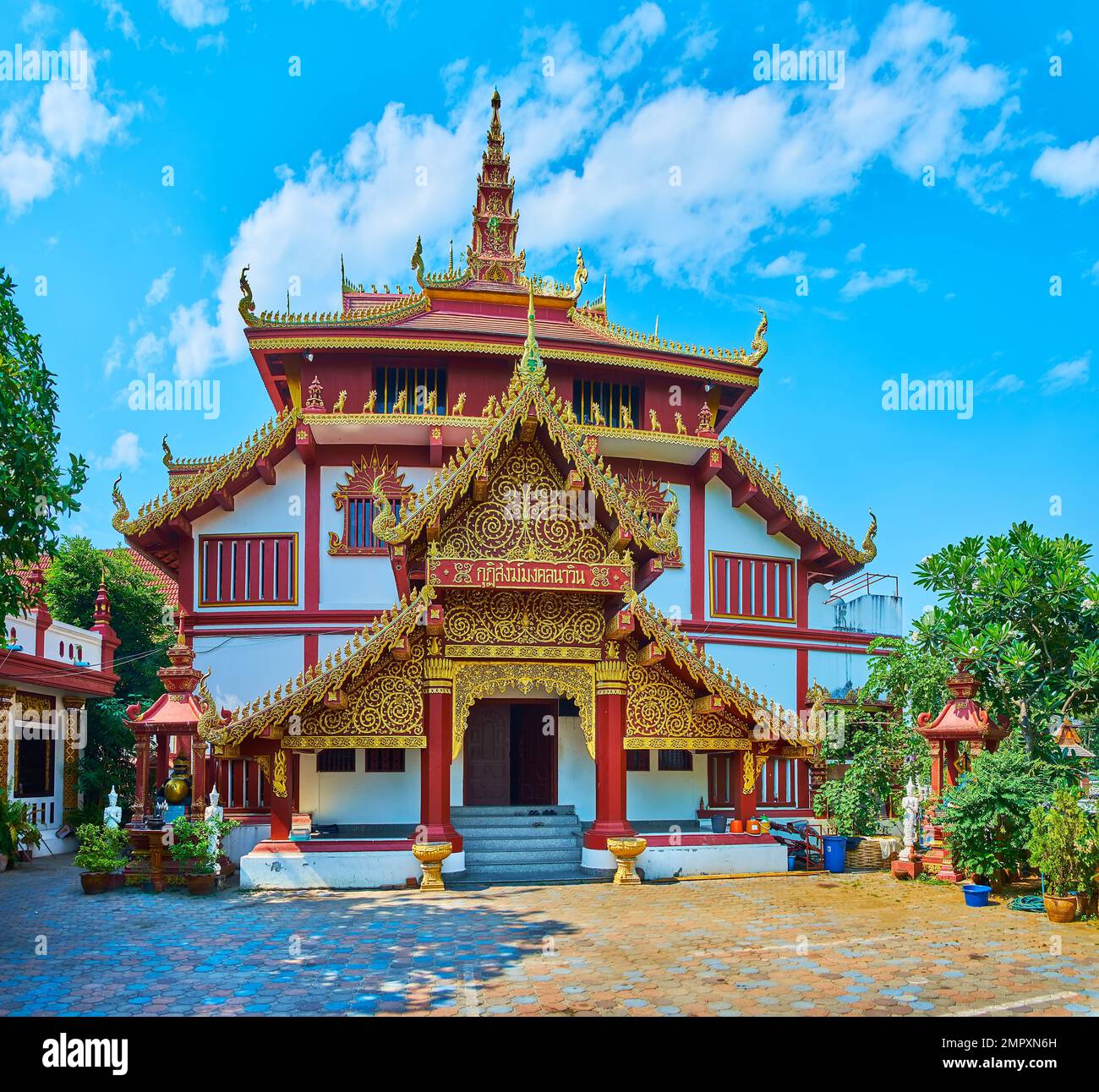 Ornate Lanna style monastic multipurpose building of Wat Ratcha Monthian temple, Chiang Mai, Thailand Stock Photo