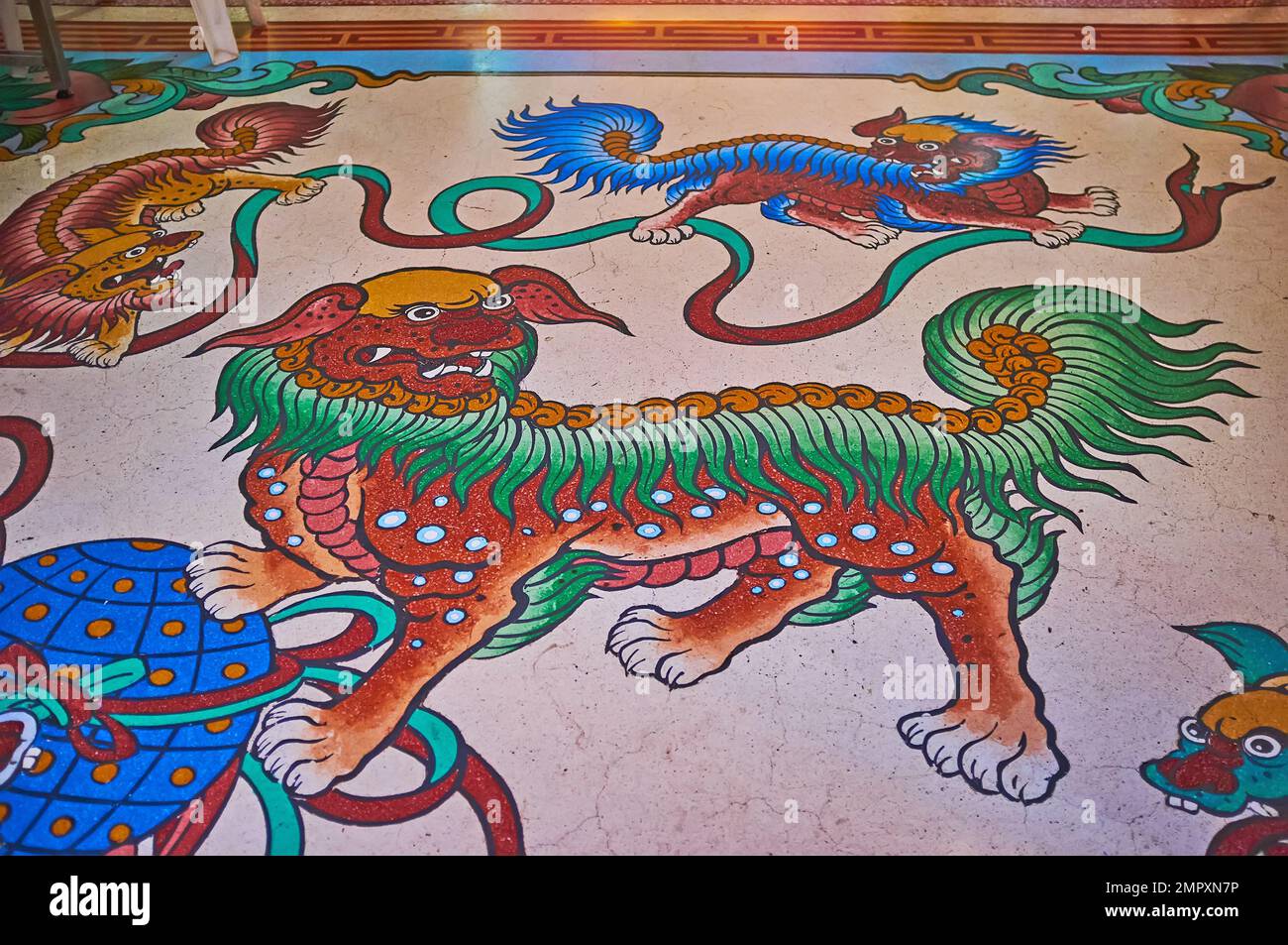 CHIANG MAI, THAILAND - MAY 3, 2019: Colored foo dogs (imperial lions) on the floor of Chinese temple, Pung Thao Kong Shrine, on May 3 in Chiang Mai Stock Photo