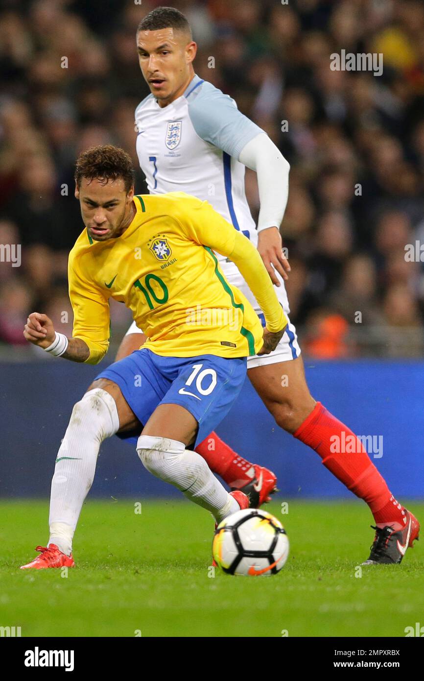 brazil-s-neymar-passes-the-ball-before-england-s-jake-livermore-can
