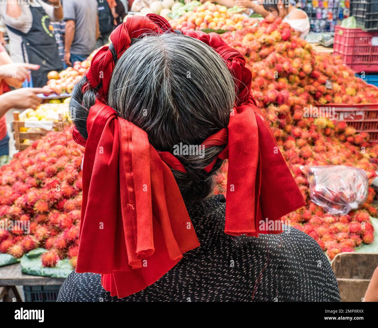 An indigenous Zapotec woman in traditional dress in the market in