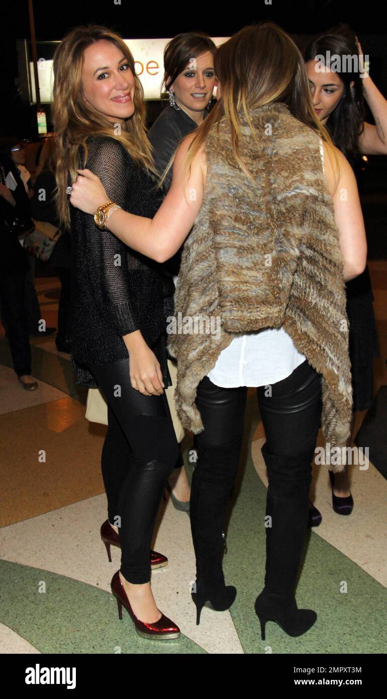 Hilary Duff and sister Haylie Duff arrive at the premiere of 'Peach Plum Pear' held at Regent Showcase Cinema during the Hollywood Reel Film Festival.  'Peach Plum Pear' stars Alanna Masterson, sister of 'That '70s Show' actor Danny Masterson.  At the premiere Hilary was looking great, albeit a bit cold, in a fur vest and skin tight leather pants paired with a studded cream clutch.  Hilary also wore her gold watch and showed off her massive diamond wedding ring. Los Angeles, CA. 12/16/10. Stock Photo