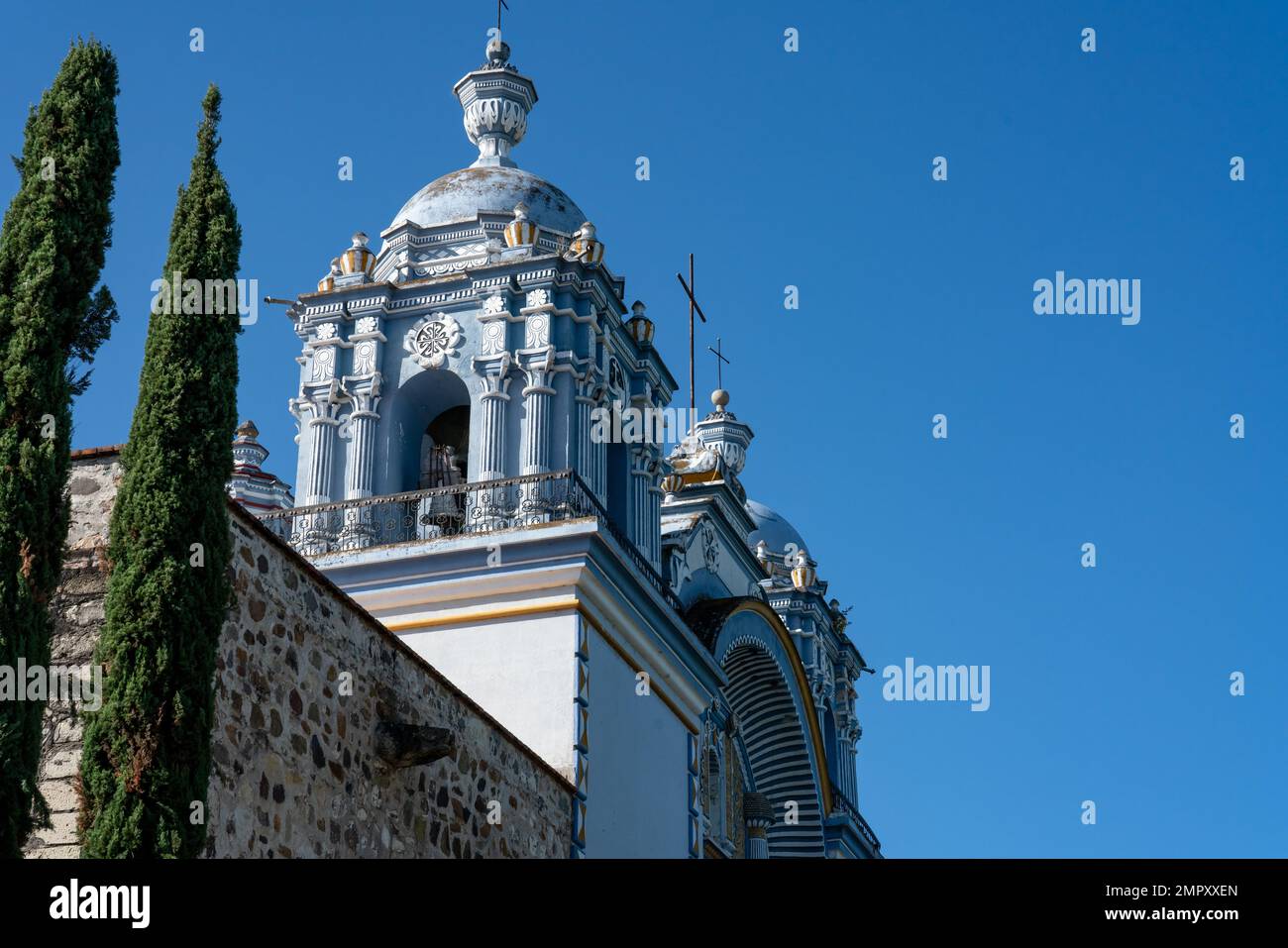 Ornately decorated bell towers of the Church of Santo Domingo de Guzman in Ocotlan de Morelos, Oaxaca, Mexico. Stock Photo