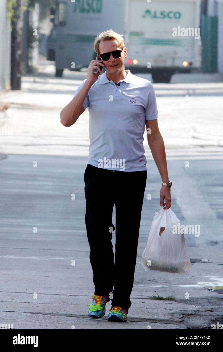 Carson Kressley wears some wild multi-colored neon sneakers and what looks like a kind of compression garment as he leaves the 'Dancing With The Stars' rehearsal studio in Hollywood, CA. 28th September 2011. Stock Photo