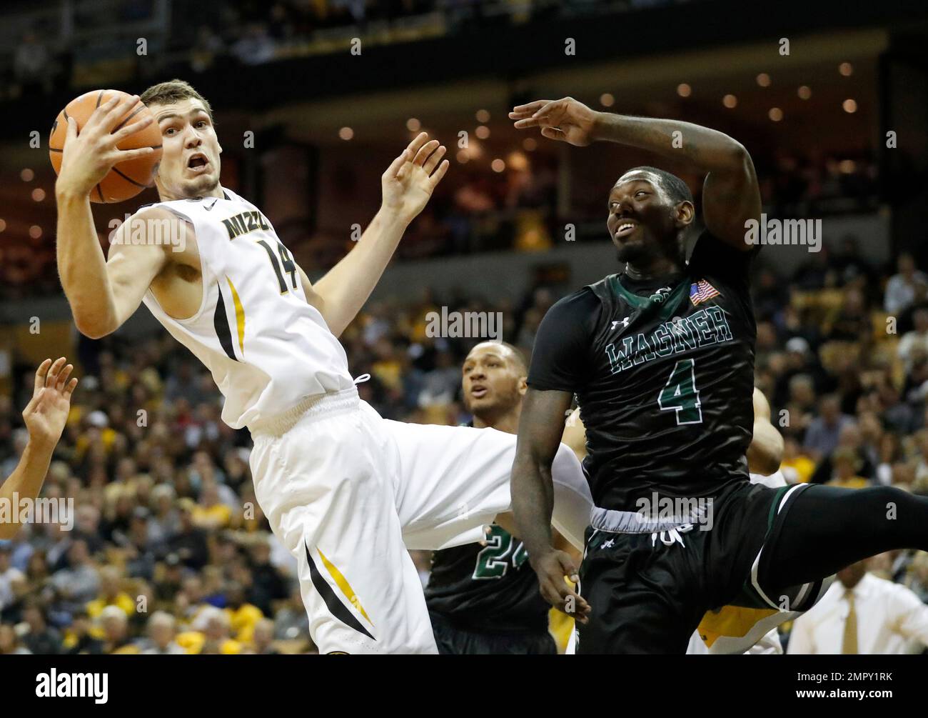 Missouri's Reed Nikko (14) pulls down a rebound as Wagner's AJ Sumbry (4)  watches during the