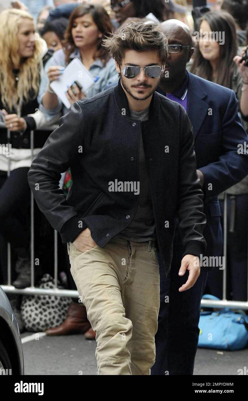 Zac Efron causes a fan frenzy as he pays a visit to the BBC studios for an  interview earlier today. The actor, who has recently grown a beard and  moustache, wore aviator