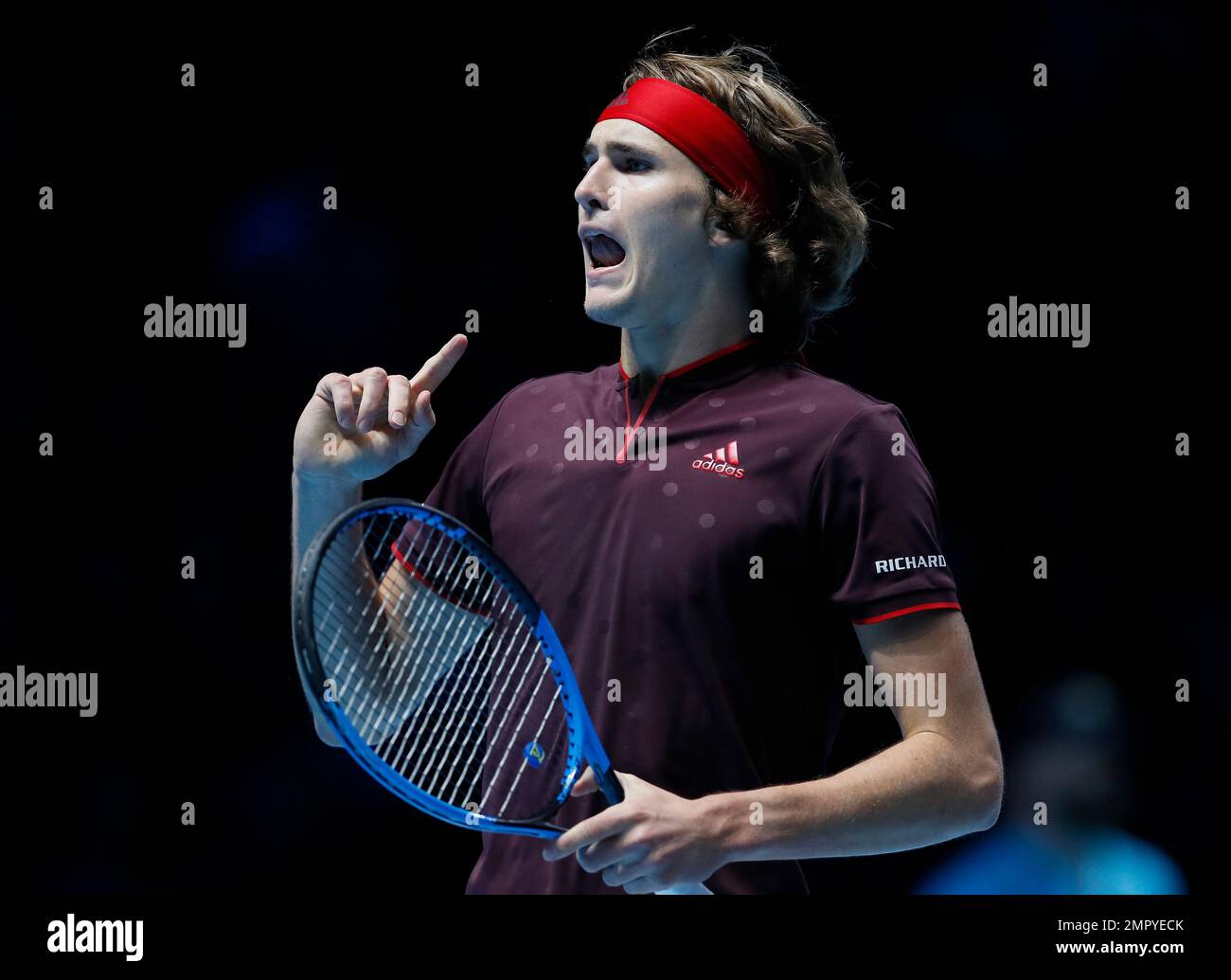Alexander Zverev of Germany celebrates winning a point after he plays a return to Marin Cilic of Croatia during their singles tennis match at the ATP World Finals at the O2 Arena