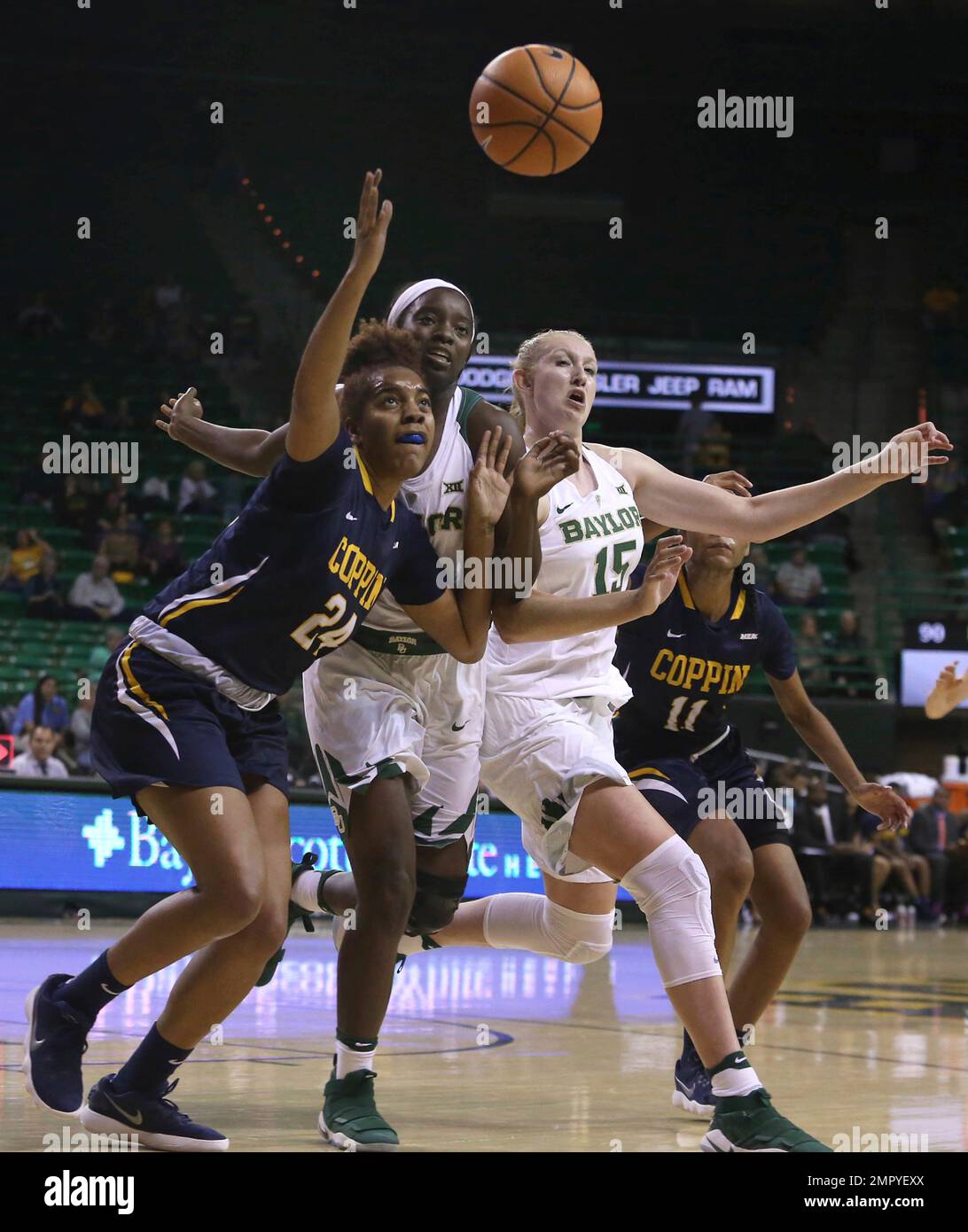 From left to right, Coppin State center Alexis Taylor (24), Baylor forward  Dekeiya Cohen, Baylor forward Lauren Cox (15) and Coppin State forward  Candice Beverly go after the ball in the second