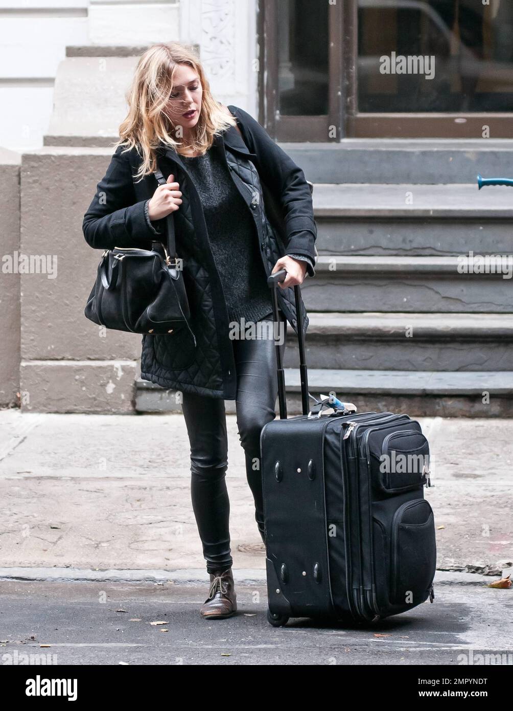 Actress Elizabeth Olsen, younger sister to famous twins Mary-Kate Olsen and Ashley Olsen, was seen departing her West Village apartment with luggage in hand as she made her way to the airport to catch a flight to Los Angeles. It's been reported that Elizabeth has become an overnight starlet with her lead debut in 'Martha Marcy May Marlene' which premiered earlier this week at the New York Film Festival. The film has a limited release date of October 21st and is already generating Oscar buzz. New York, NY. 13th October 2011.    . Stock Photo