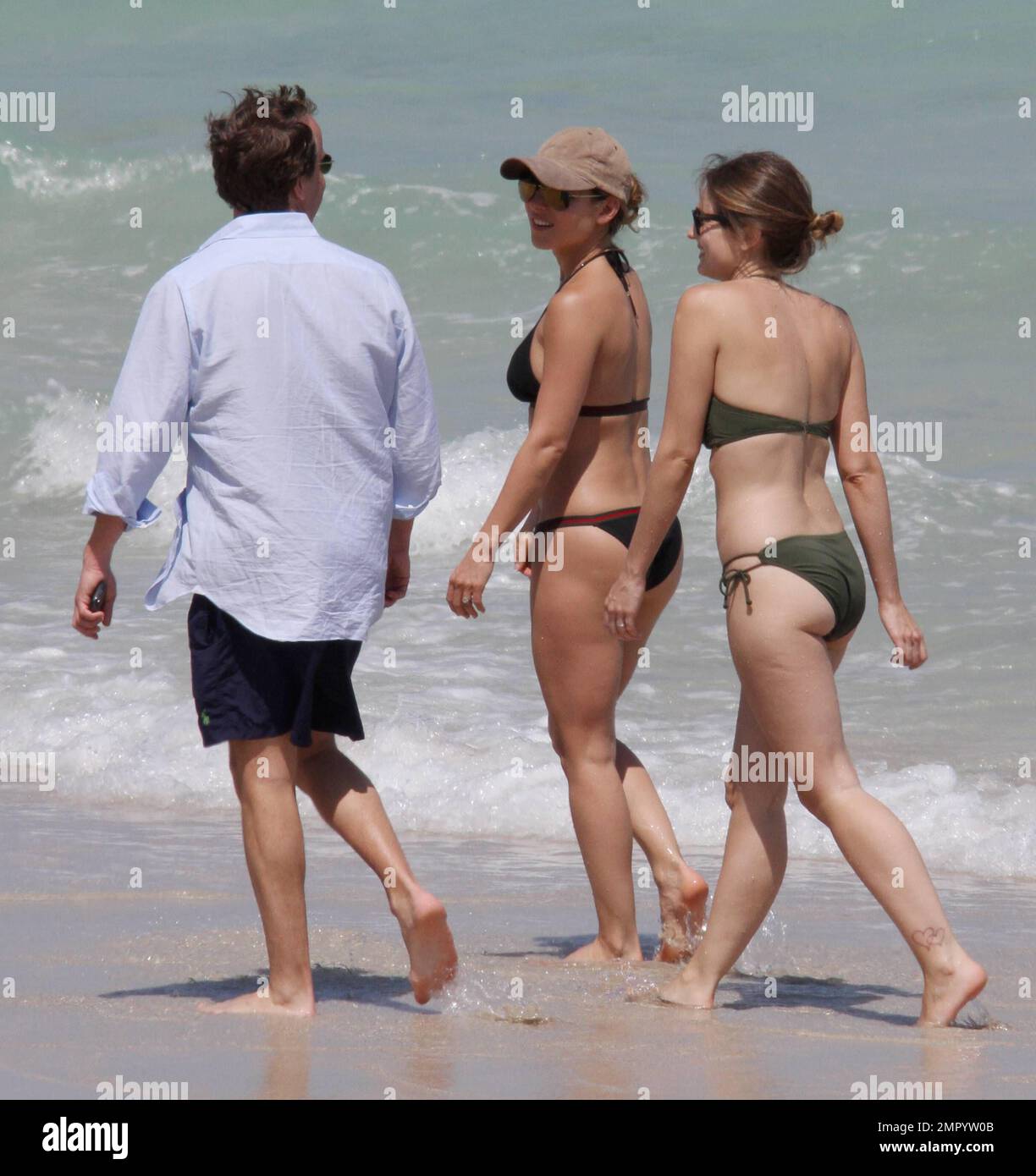 Elsa Pataky shows off her amazing figure whilst strolling along the beach in a black bikini and wearing a baseball cap.   The Spanish actress spent time in Miami this week to promote her new movie "Fast Five." Miami Beach, FL. 4/7/11. Stock Photo