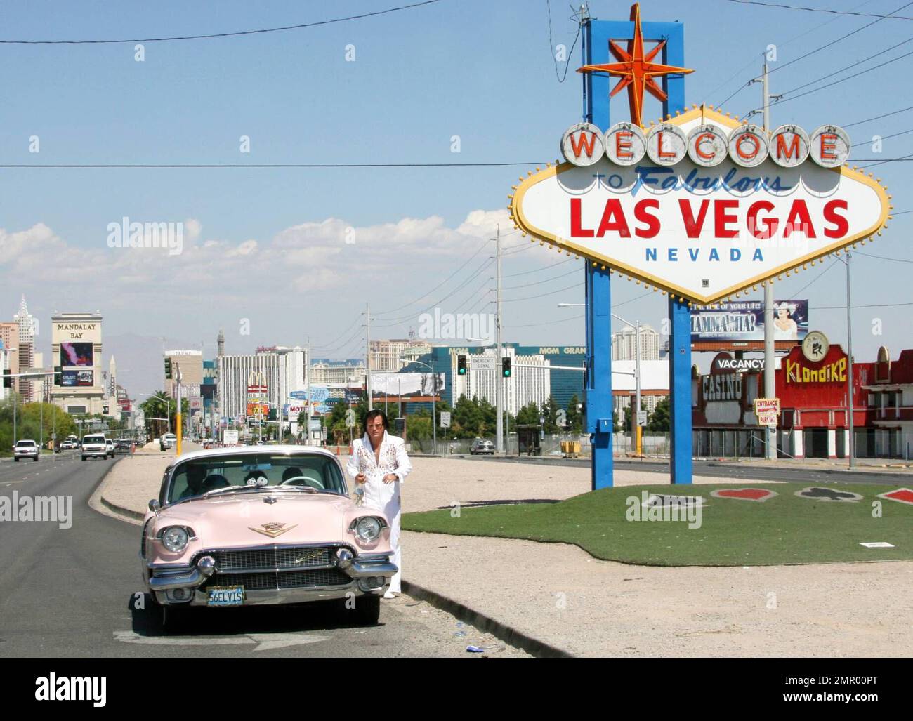 Exclusive!! The King takes some time out from eternity to help out with a  wedding on the Las Vegas Strip. This Elvis impersonator takes his craft  seriously, right down to his 1956