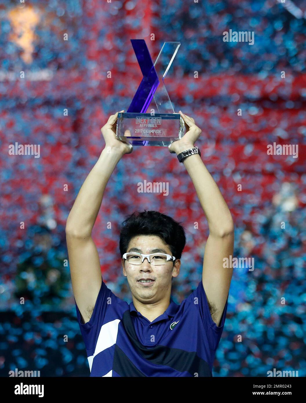 Hyeon Chung, of South Korea, holds up the trophy after winning the ATP Next  Gen tennis finals in Milan, Italy, Saturday, Nov. 11, 2017. (AP  Photo/Antonio Calanni Stock Photo - Alamy