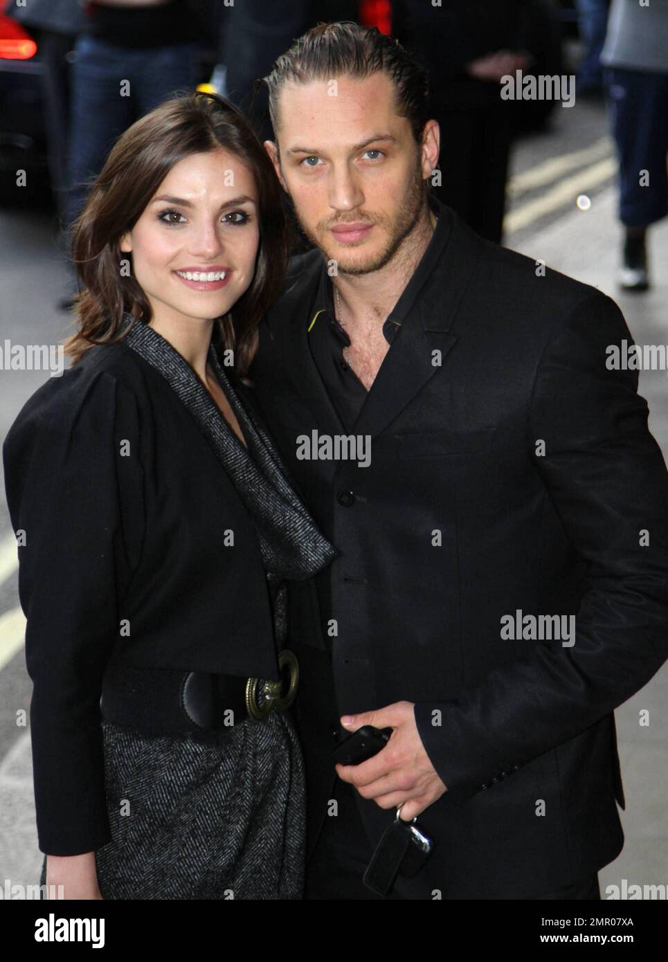 Tom Hardy and Charlotte Riley pose for the camera at the English