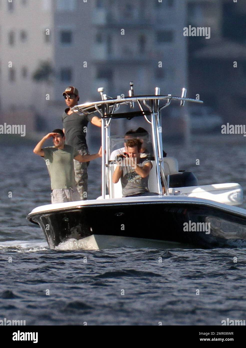 EXCLUSIVE!! Pop music superstar Enrique Iglesias takes to the waves and the  skies with a video crew to film his action-packed lifestyle in Miami.  Iglesias took to the sea in his boat