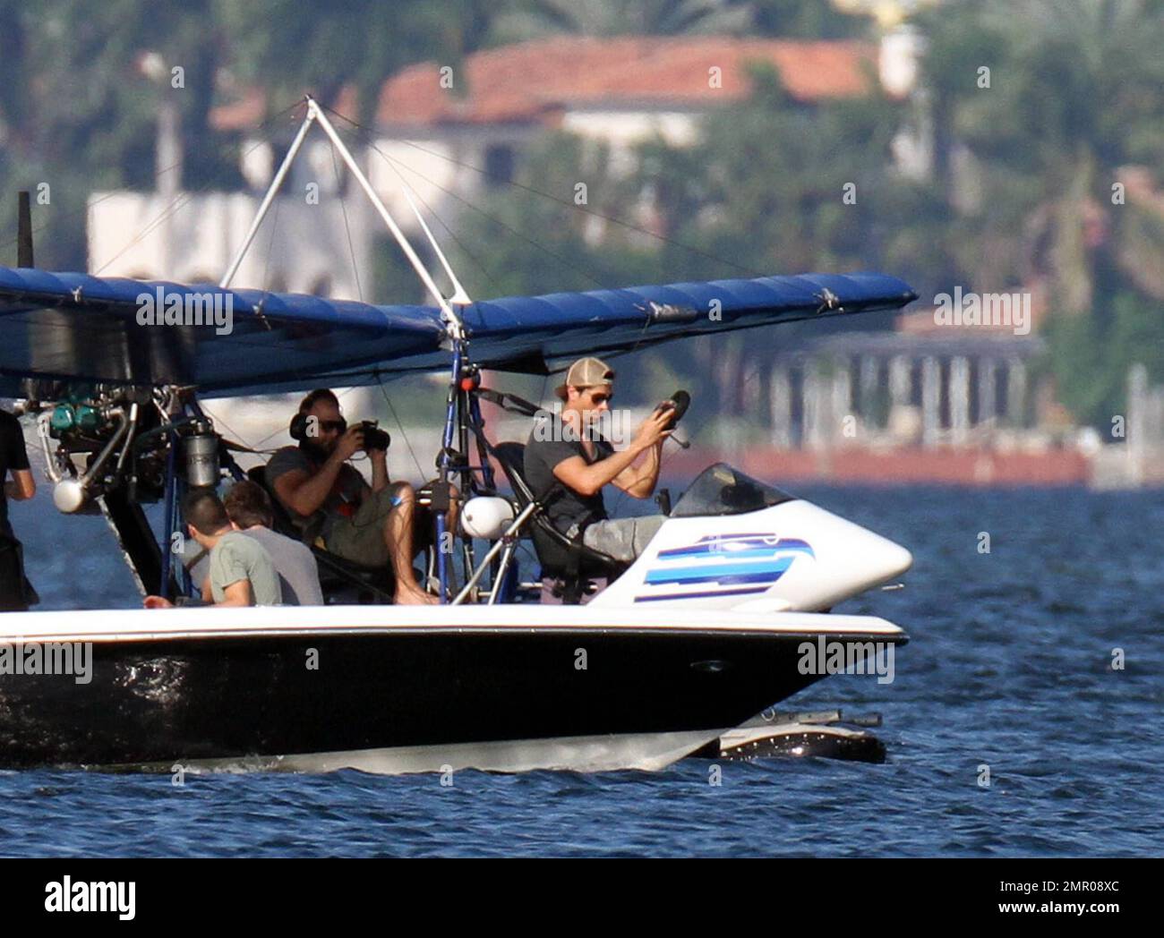 EXCLUSIVE!! Pop music superstar Enrique Iglesias takes to the waves and the  skies with a video crew to film his action-packed lifestyle in Miami.  Iglesias took to the sea in his boat