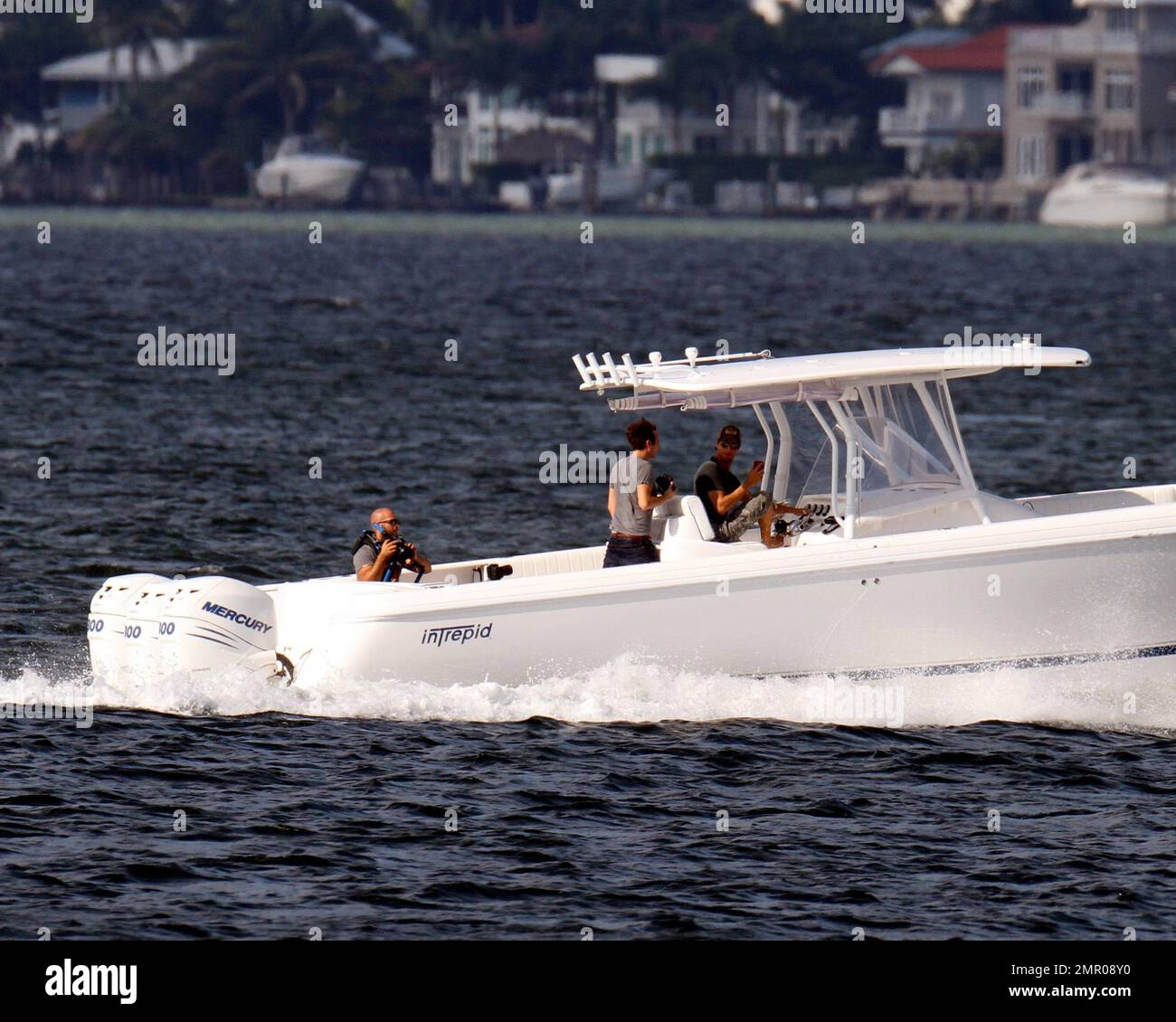 EXCLUSIVE!! Pop music superstar Enrique Iglesias takes to the waves and the  skies with a video crew to film his action-packed lifestyle in Miami.  Iglesias took to the sea in his boat