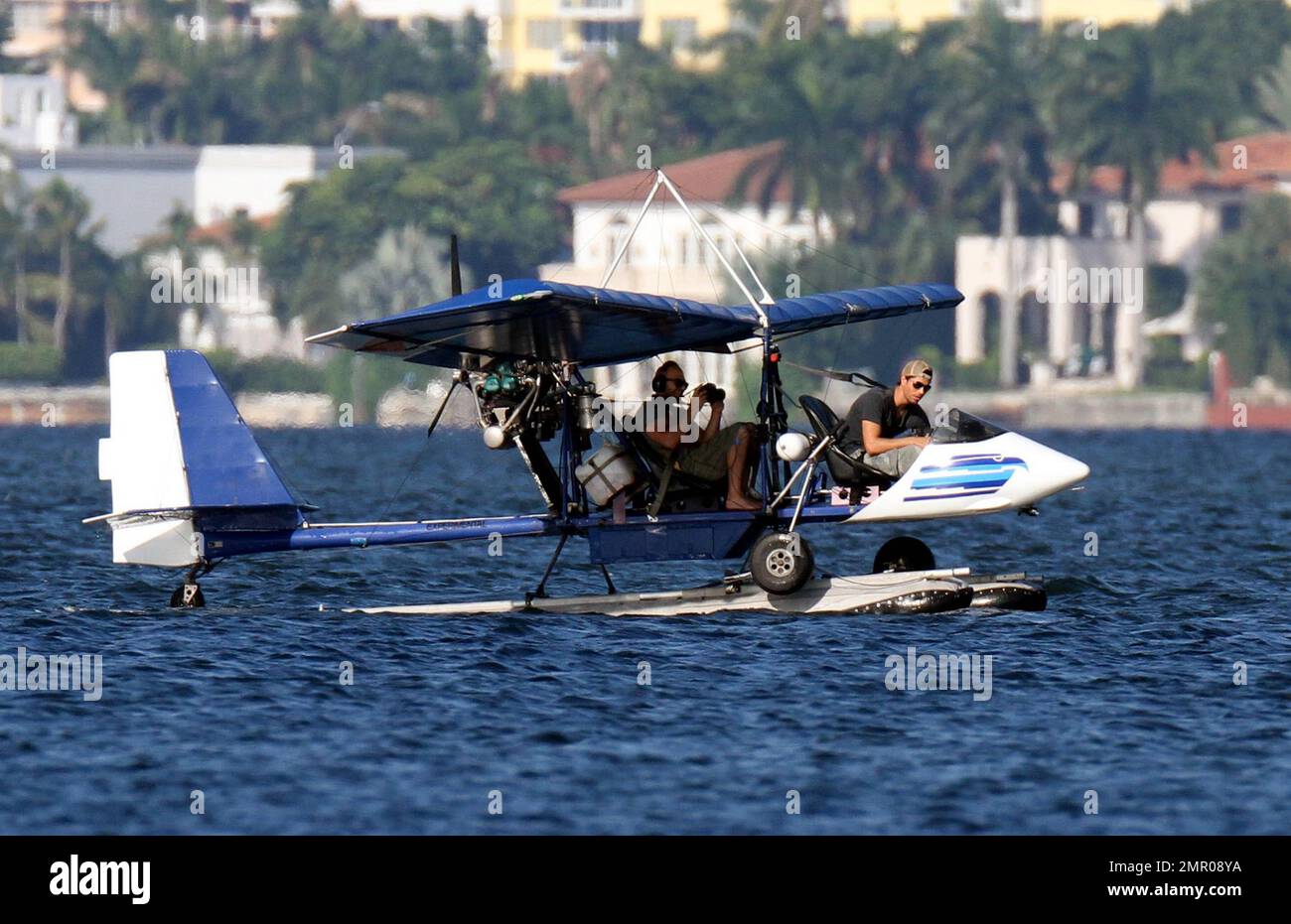 EXCLUSIVE!! Pop music superstar Enrique Iglesias takes to the waves and the  skies with a video crew to film his action-packed lifestyle in Miami.  Iglesias took to the sea in his boat