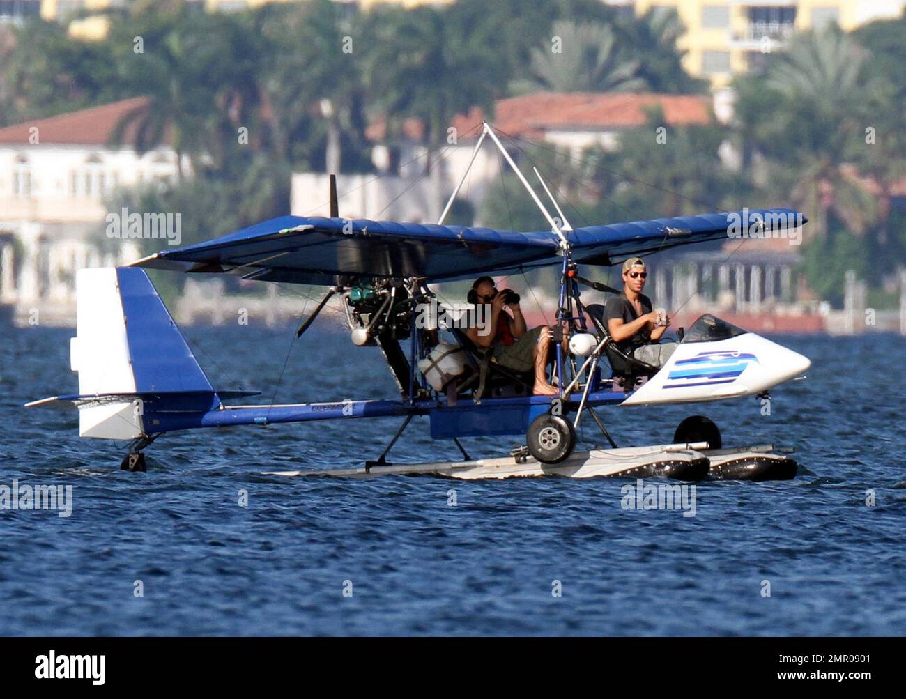 EXCLUSIVE!! Pop music superstar Enrique Iglesias takes to the waves and the  skies with a video crew to film his action-packed lifestyle in Miami.  Iglesias took to the sea in his boat