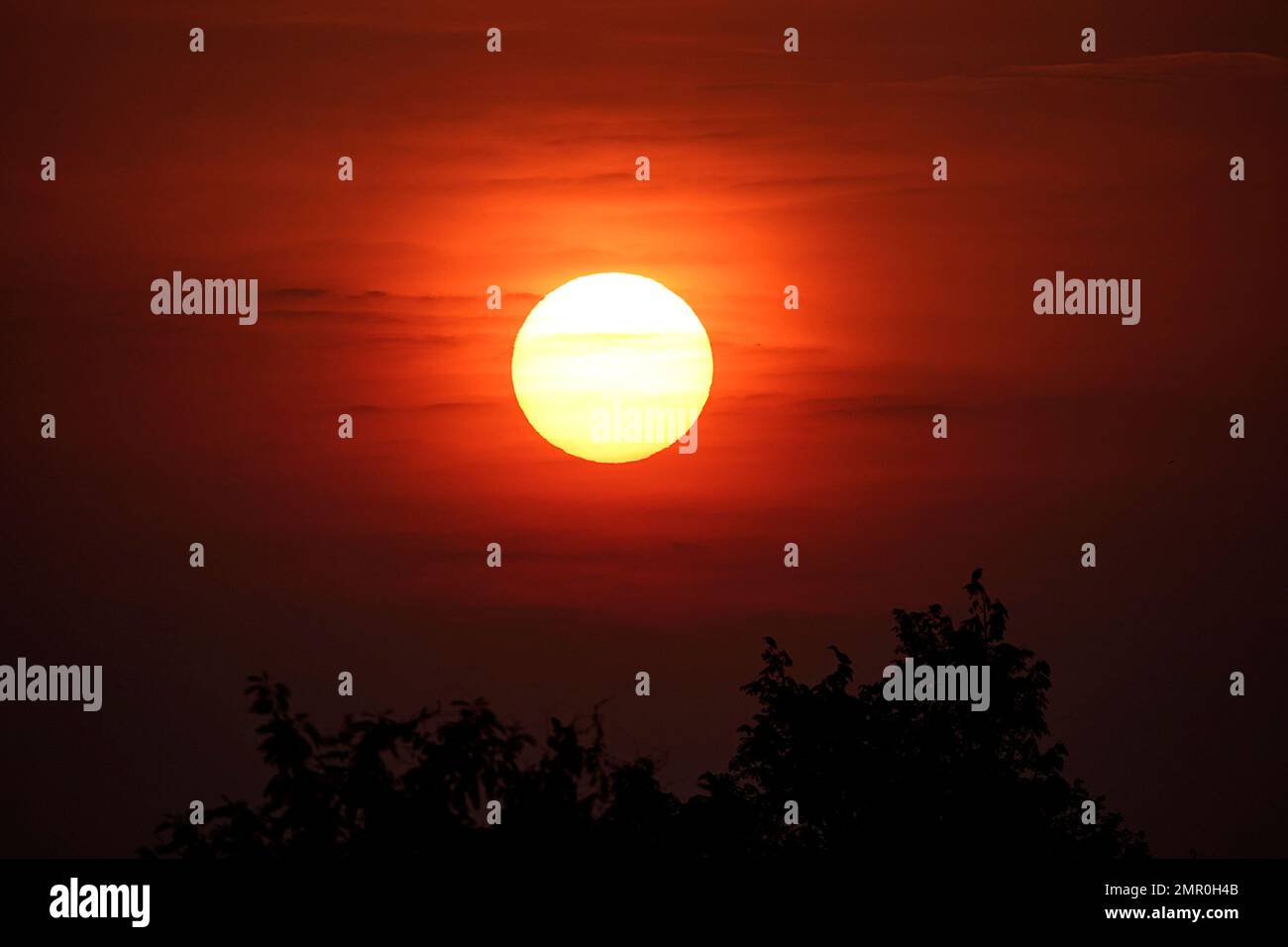 a Beautiful crimson red sunse Stock Photo - Alamy
