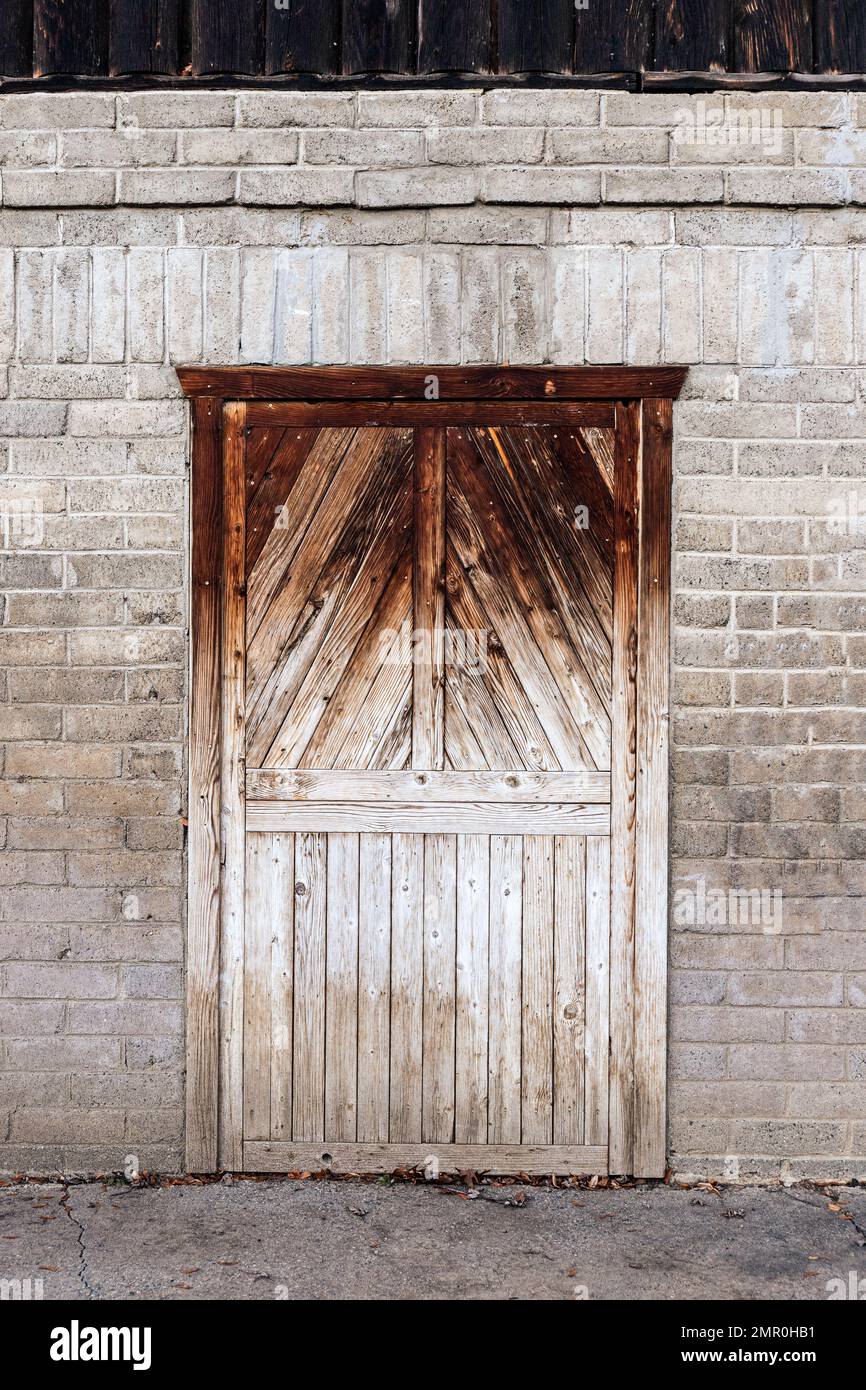 Rustic Wood Door in a Brick Wall Stock Photo Alamy