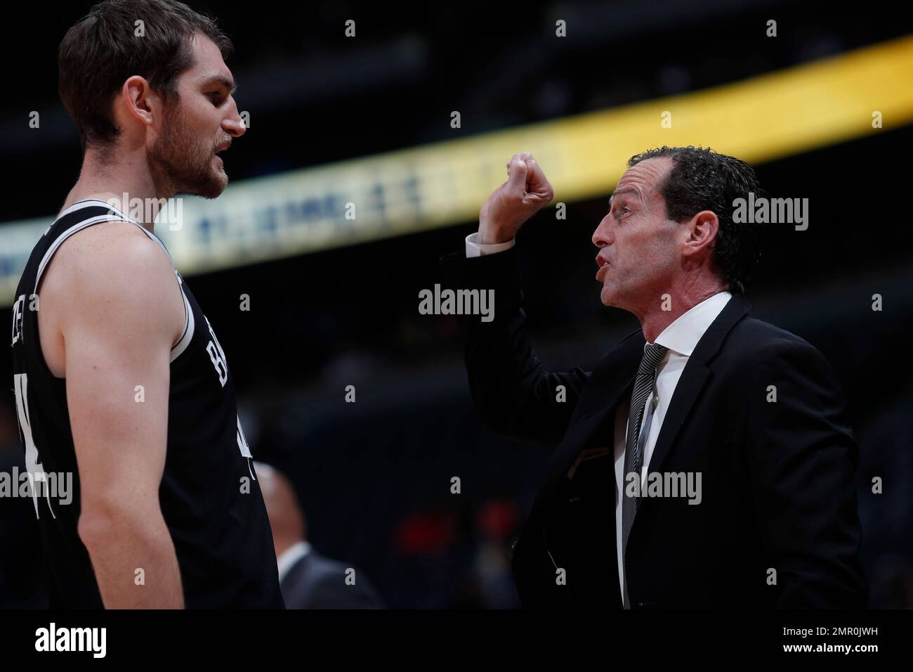 Brooklyn Nets head coach Kenny Atkinson confers with Brooklyn Nets