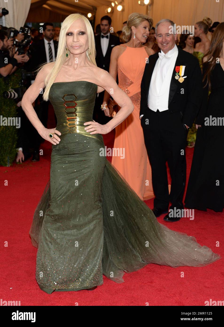 FILE - In this May 5, 2014, file photo, Donatella Versace attends The  Metropolitan Museum of Art's Costume Institute benefit gala celebrating  "Charles James: Beyond Fashion" in New York. The Met announced