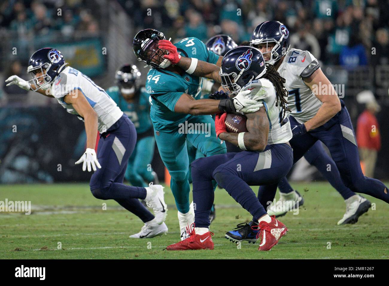 Tennessee Titans running back Derrick Henry (22) is tackled for a