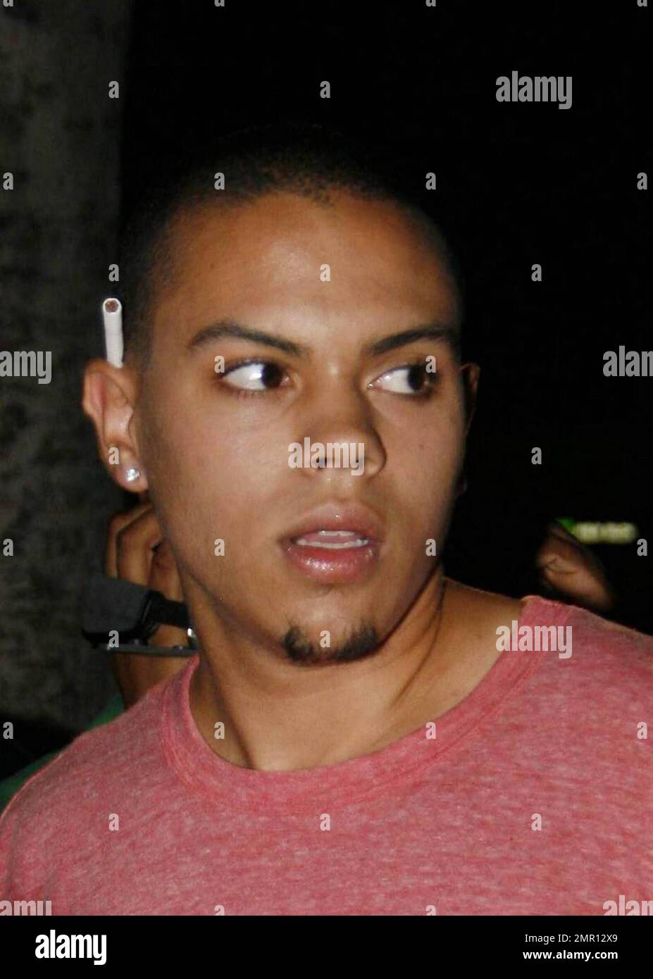 Evan Ross pauses outside the club My House with a cigarette tucked behind  his ear and couldn't wait to smoke it as there is a smoking ban inside all  public places. Los
