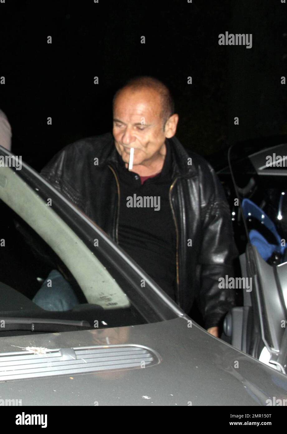 Exclusive!! Joe Pesci and Angie Everhart leave the restaurant AGO. Everhart makes her way quickly to the waiting car, hiding her face as much as possible, but Pesci smokes a cigarette while signing autographs and taking photos with fans. Los Angeles, CA. 10/21/08. Stock Photo