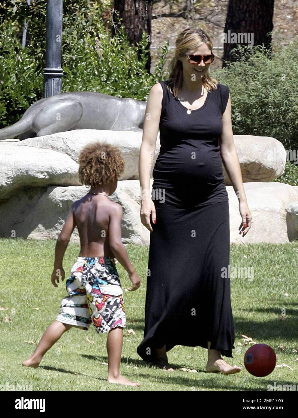 A very pregnant Heidi Klum shows off an accentuated bump in a tight