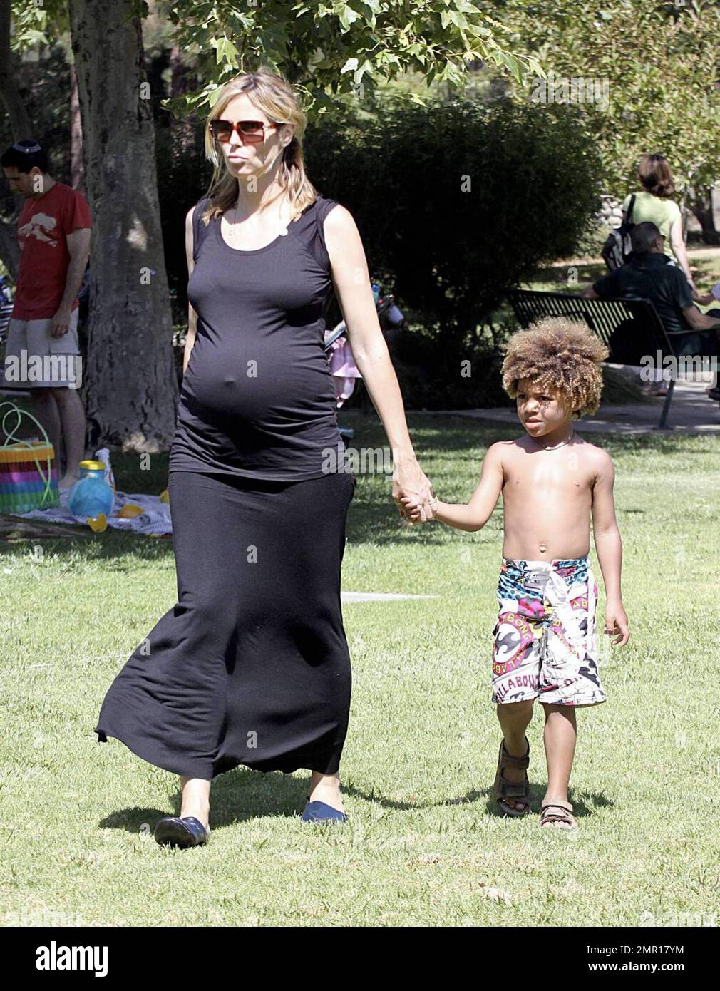 A very pregnant Heidi Klum shows off an accentuated bump in a tight