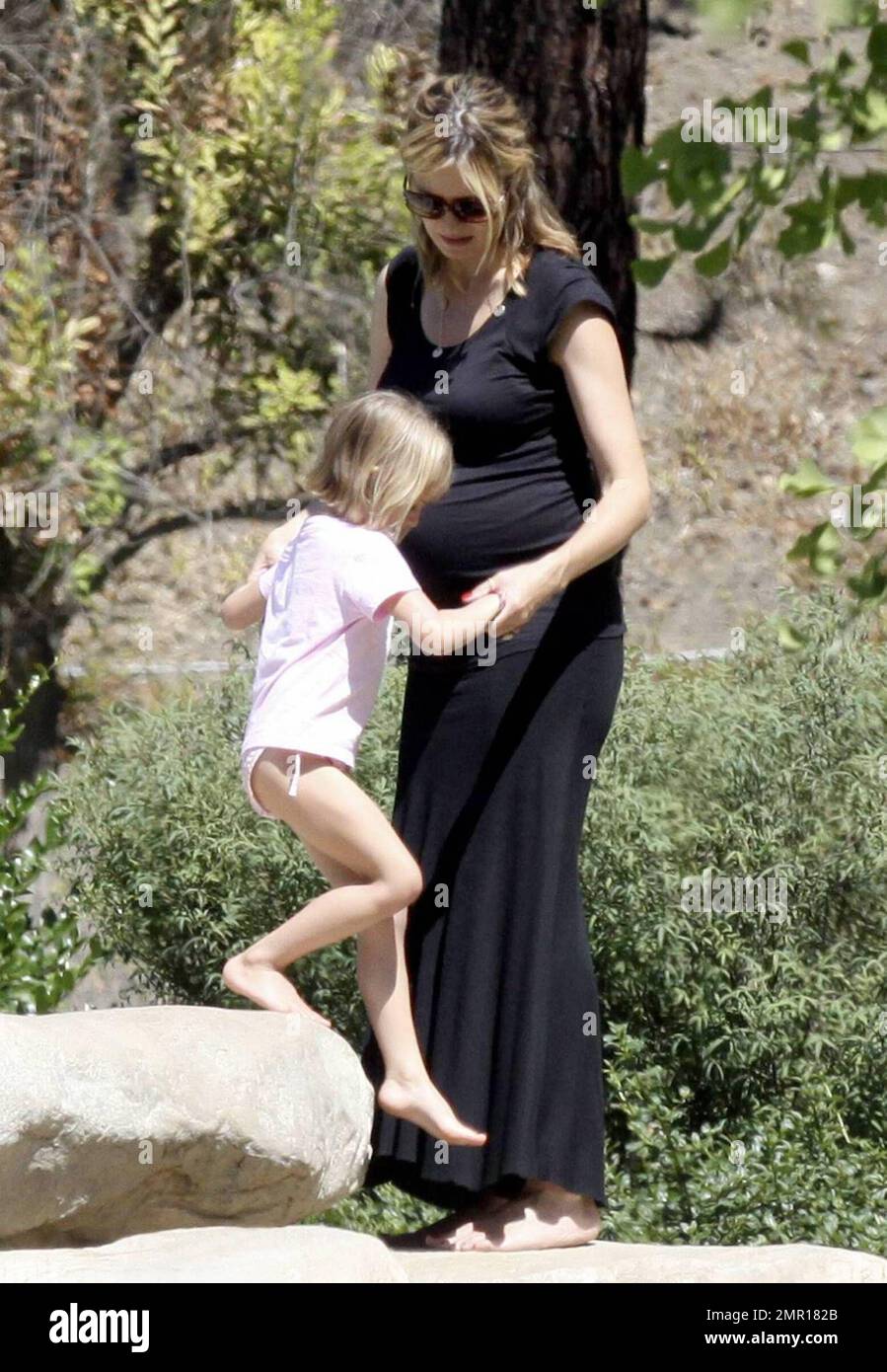 A very pregnant Heidi Klum shows off an accentuated bump in a tight