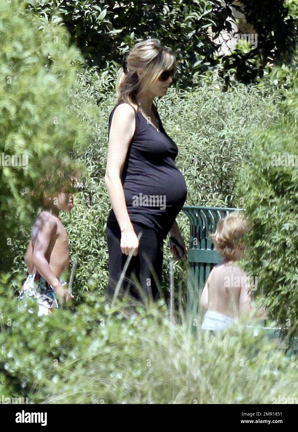 A very pregnant Heidi Klum shows off an accentuated bump in a tight