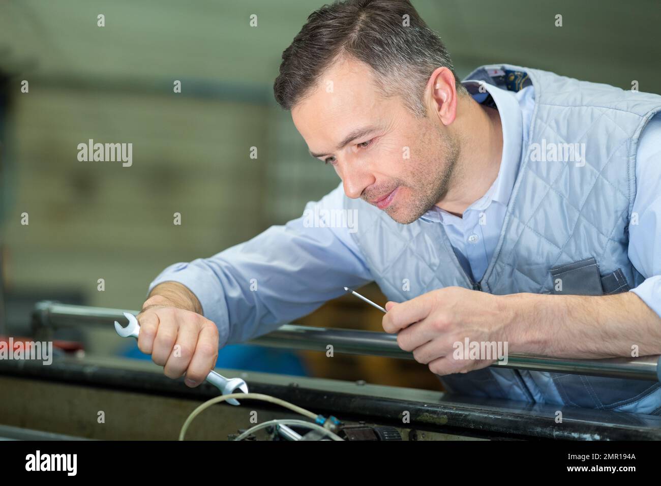 Person Using Wrench Person using wrench tighten hi-res stock photography and images - Alamy