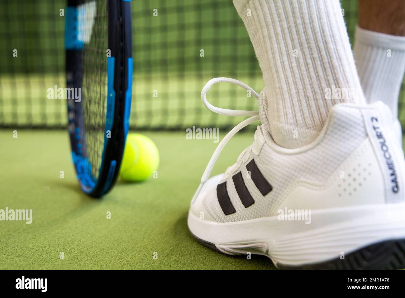 Symbol image Tennis: Close up of a tennis player in the hall Stock Photo