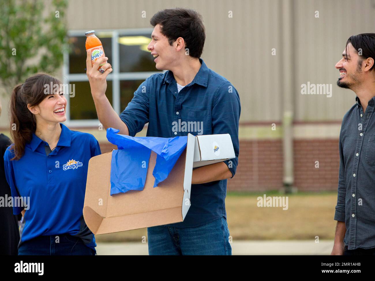 Fredy Torres (center), a senior at Horatio, AR high school reacts to