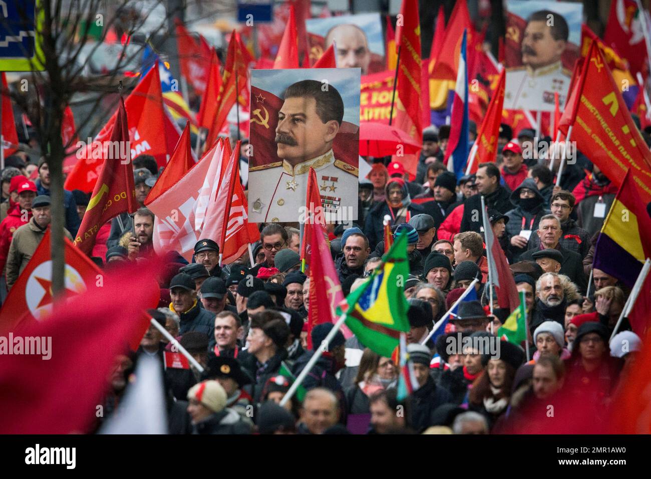 Communist party supporters carry portraits of Soviet founder Vladimir ...