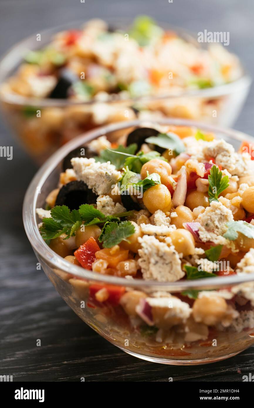 Home made vegan chickpea farro salad with vegan feta. Stock Photo