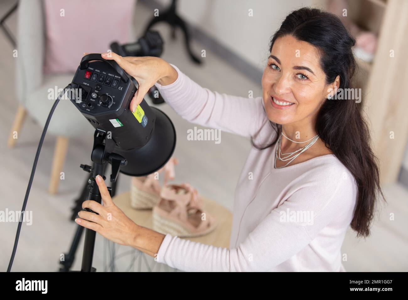 Woman photographer setting up digital hi-res stock photography and ...
