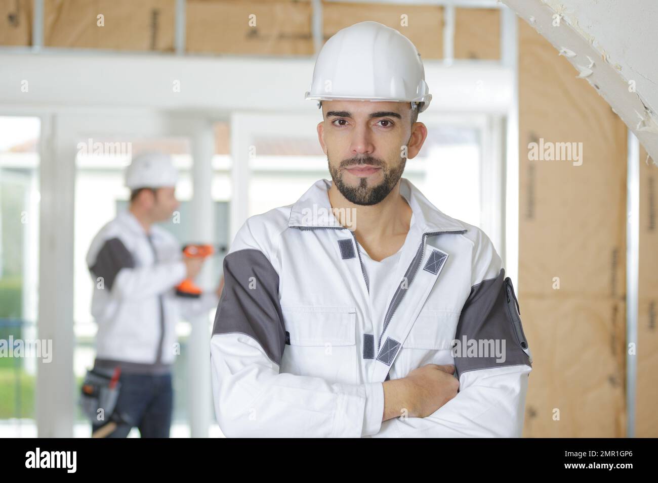 portrait of young confident worker Stock Photo - Alamy