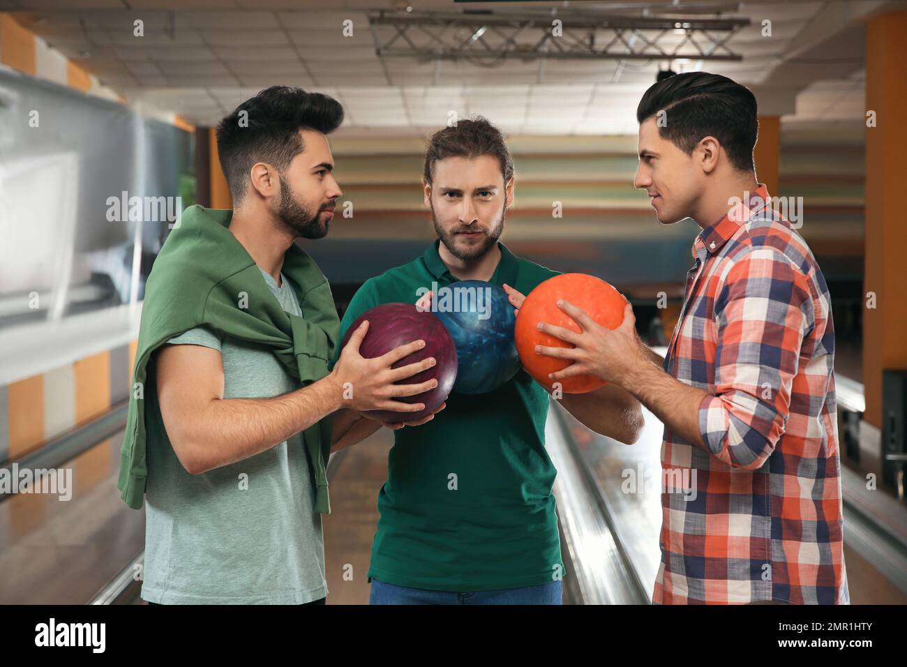 Group of men with balls in bowling club Stock Photo Alamy