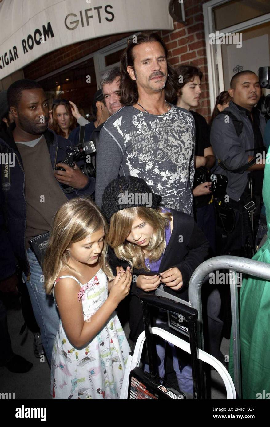 Lorenzo Lamas and his daughters attend the grand opening party for