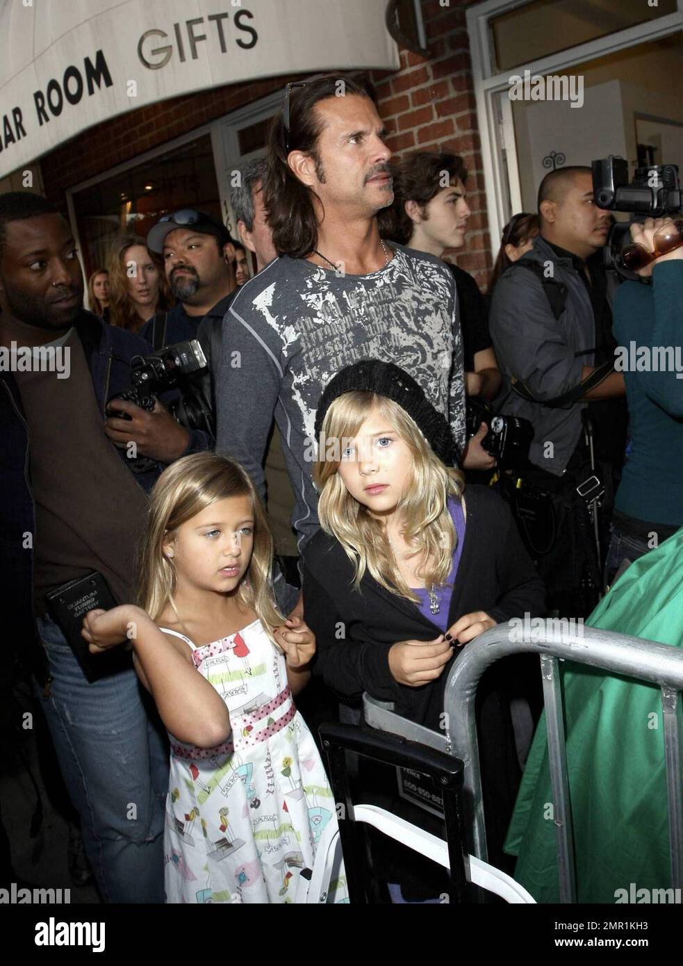 Lorenzo Lamas and his daughters attend the grand opening party for