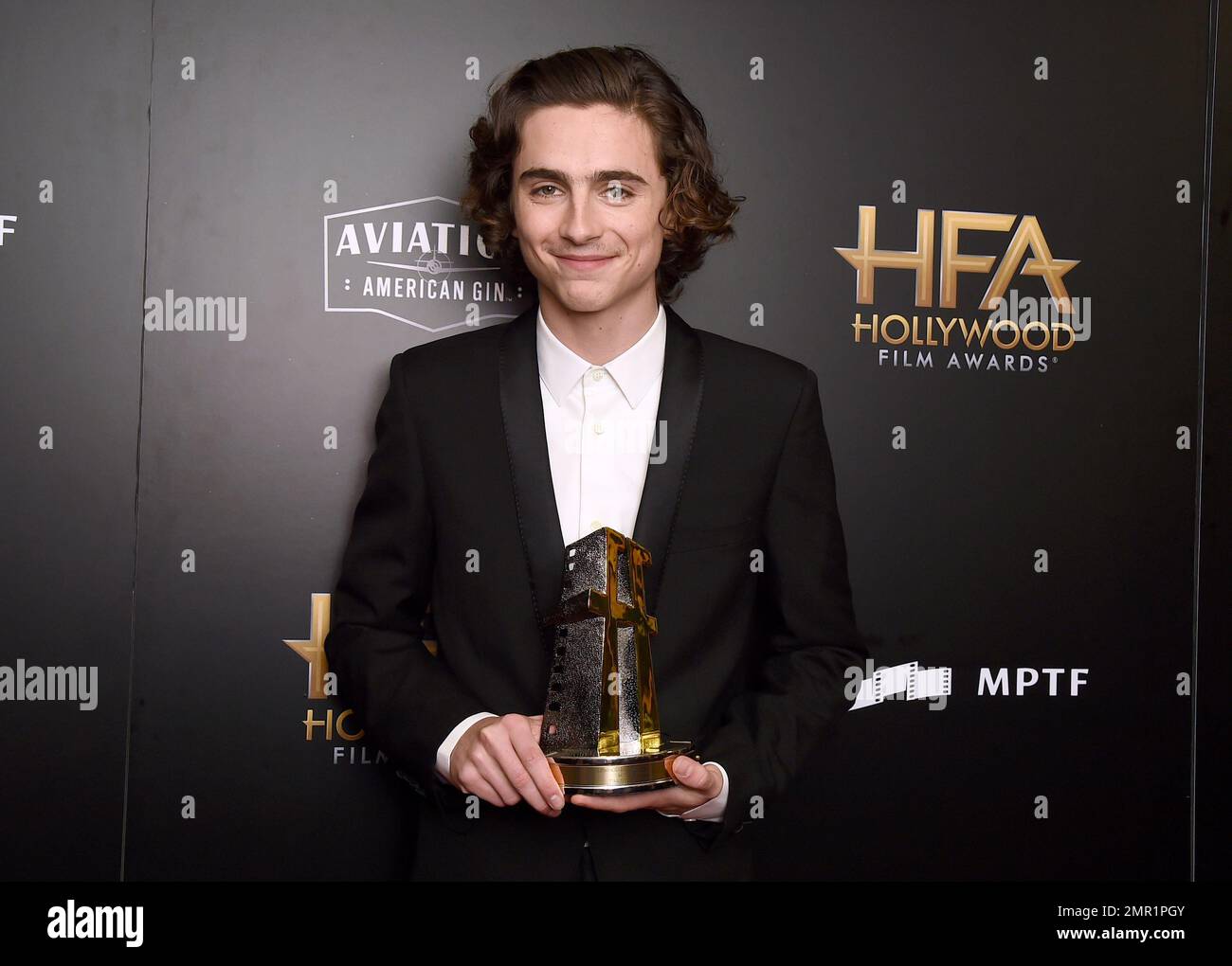 Timothee Chalamet poses in the press room with the Hollywood breakout