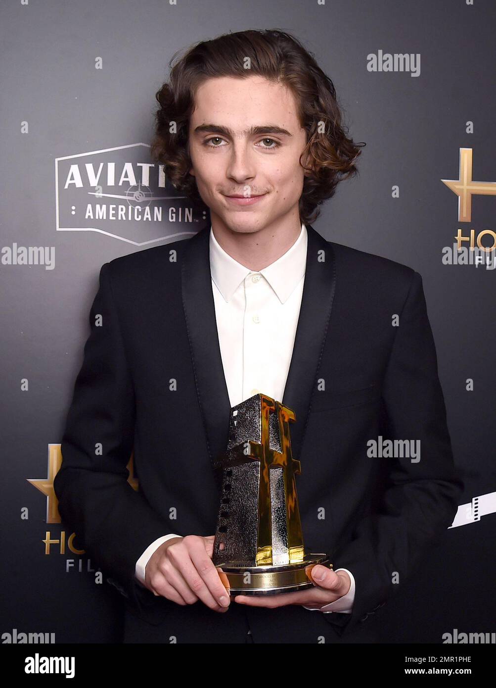 Timothee Chalamet poses in the press room with the Hollywood breakout