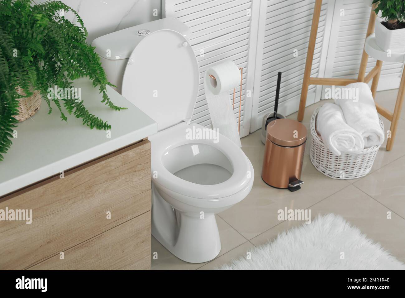 Stylish toilet bowl in modern bathroom interior Stock Photo - Alamy