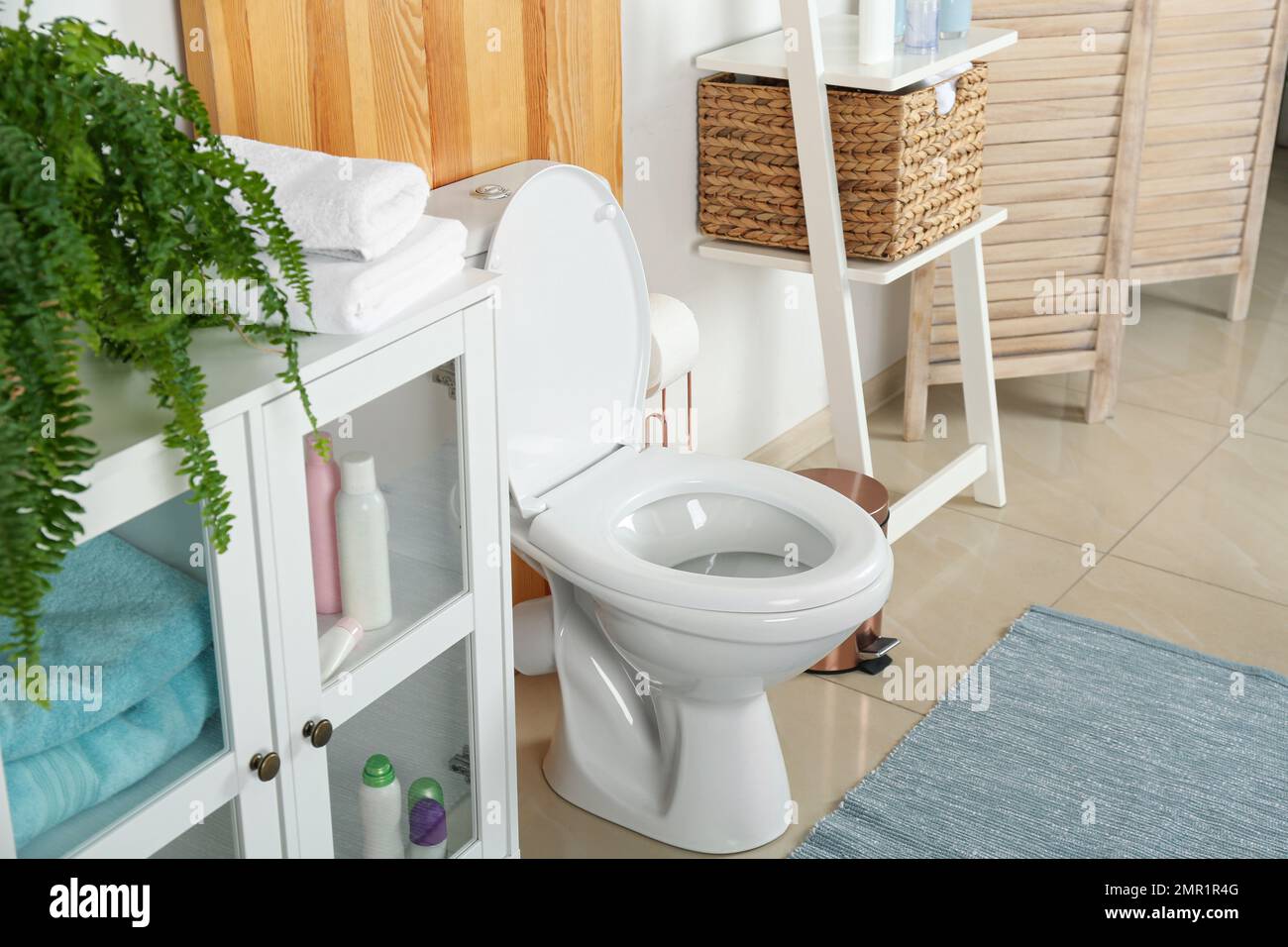 Stylish toilet bowl in modern bathroom interior Stock Photo - Alamy